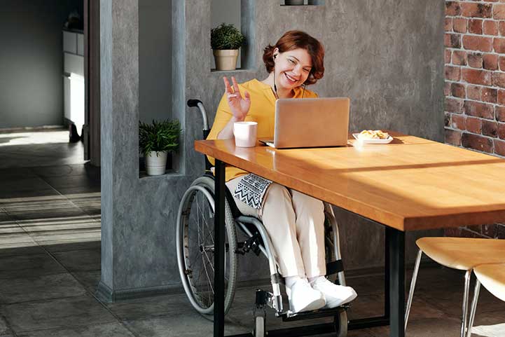 The wheelchair girl is happy to use MyBizzHive freelancers CRM that offers flexible packages for growing business